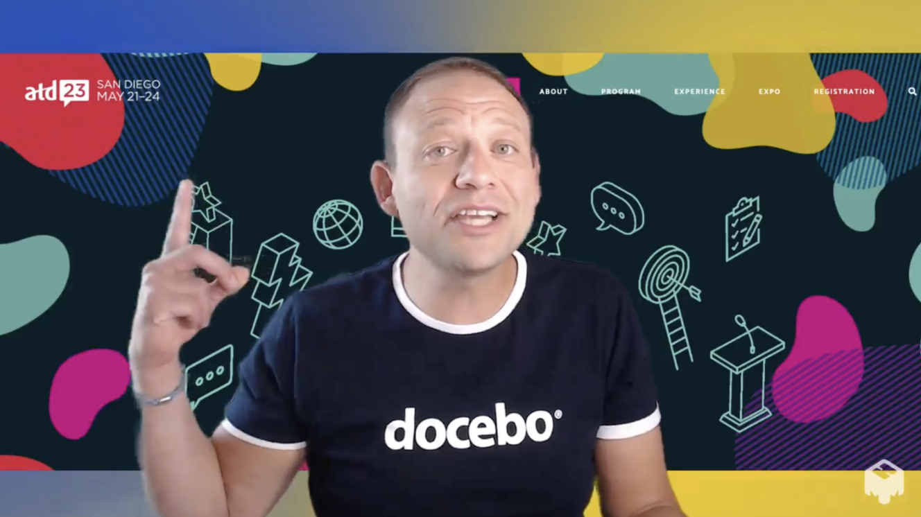 Alex Smith wearing docebo shirt against colorful background