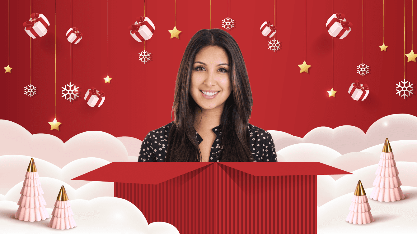 woman with dark hair and a black and white shirt popping out of a red gift box